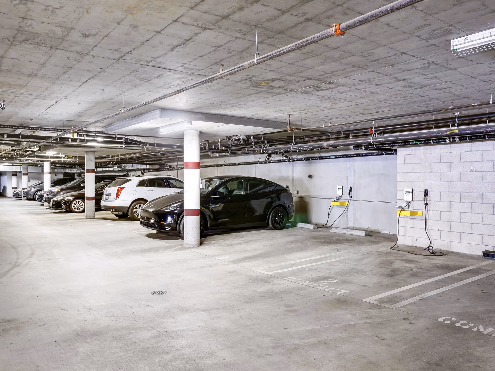 garage/covered parking/car charging station at The Metropolitan at Larchmont Village Apartments