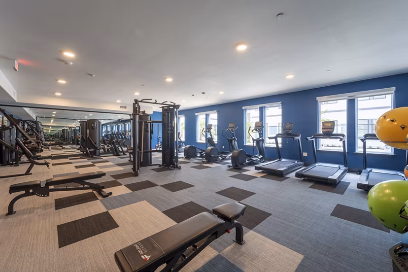 fitness center at COOP Farmers Market Apartments 