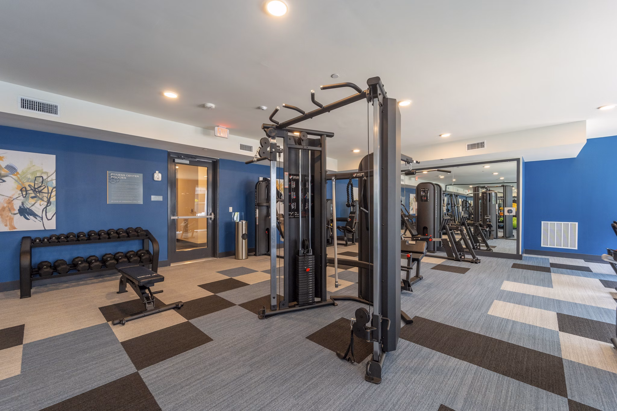 fitness center at COOP Farmers Market Apartments 