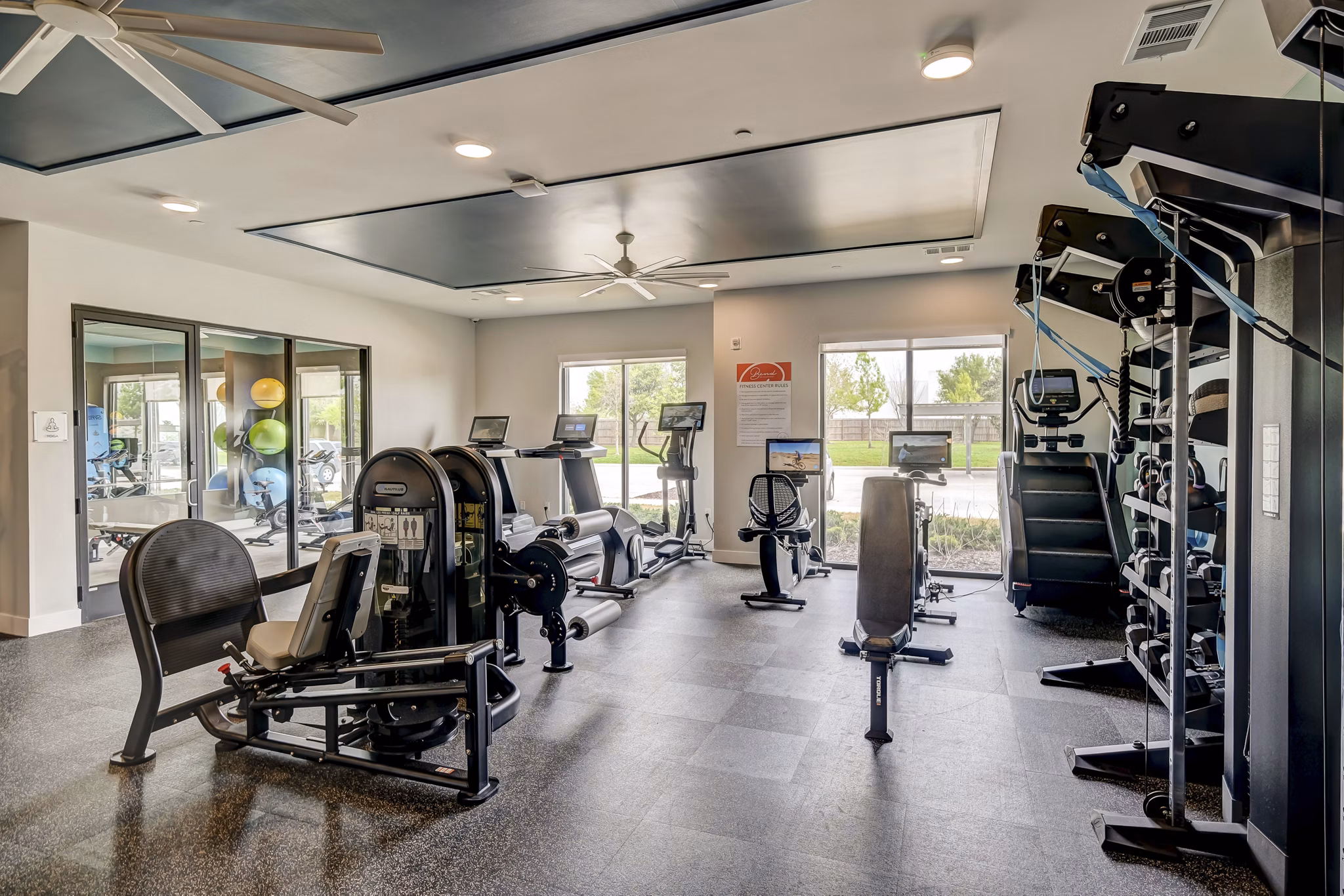 fitness center at Bend on Bluebonnet Apartments