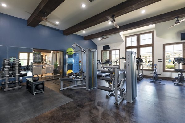 fitness center at 4 Corners Apartments 