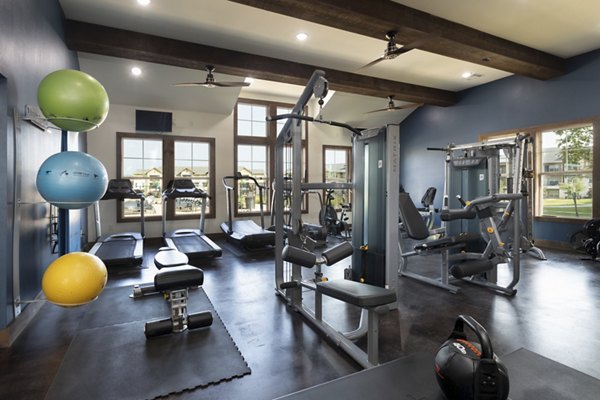 fitness center at 4 Corners Apartments 