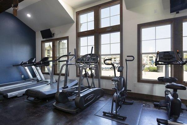 fitness center at 4 Corners Apartments 