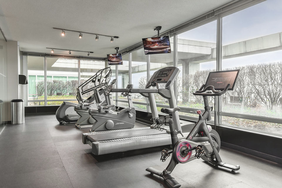 fitness center at Optima Old Orchard Woods Apartments
