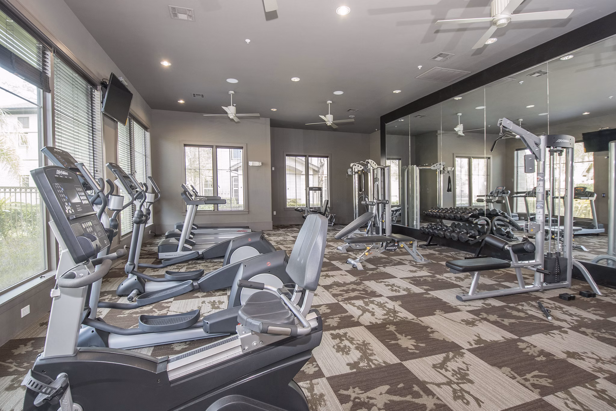 fitness center at Ten Pines at Summerwood Apartments 