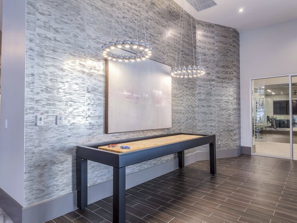 clubhouse game room at The Adeline Apartments