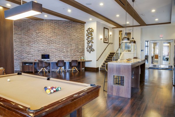 clubhouse game room at New Village at Patchogue Apartments