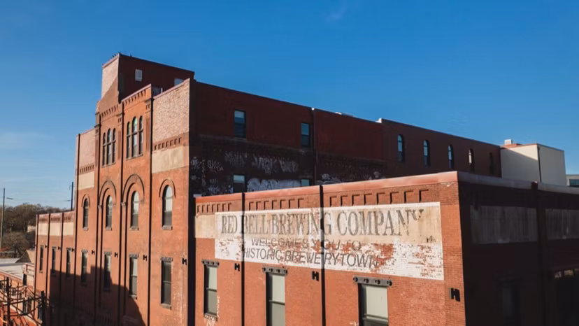 building/exterior at Poth Brewery Lofts Apartments