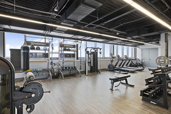 fitness center at The Grandb Apartments