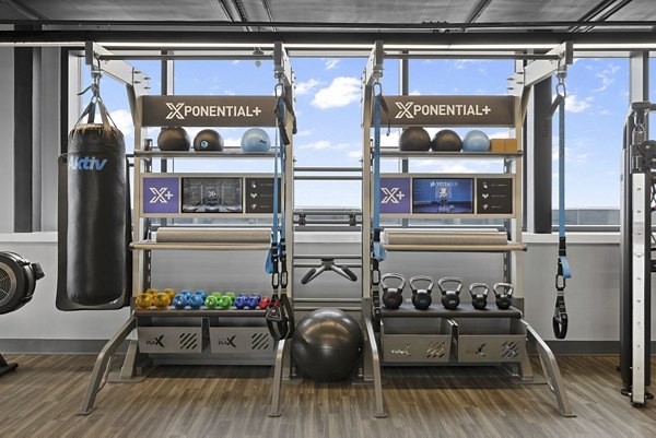 fitness center at The Grandb Apartments