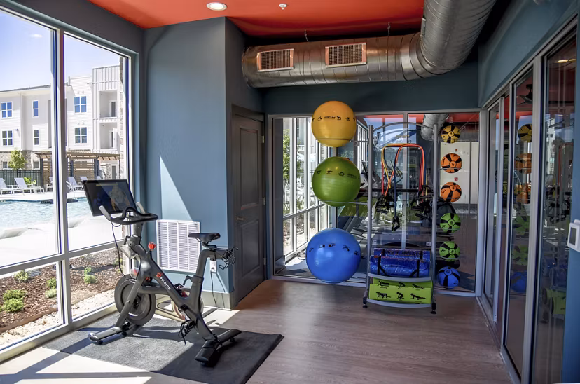 fitness center  at The Oaks at Riverbend Apartments 