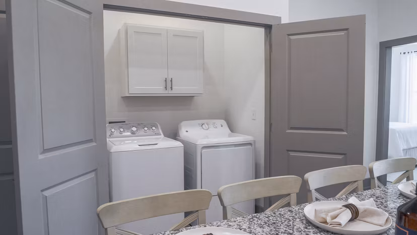 laundry facility at The Oaks at Riverbend Apartments 
