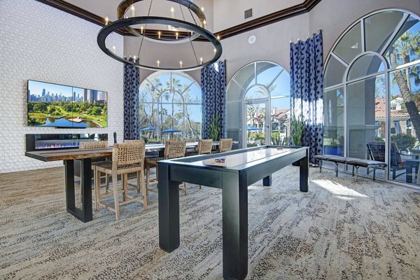 clubhouse game room at The Academy Apartments