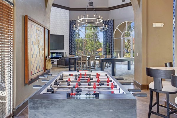 clubhouse game room at The Academy Apartments