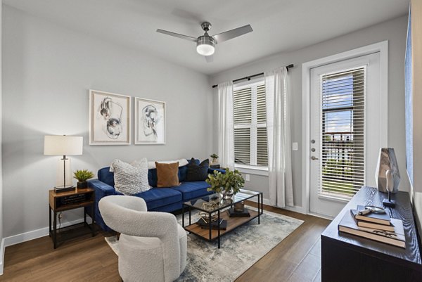 living room at Peak at 1385 Apartments