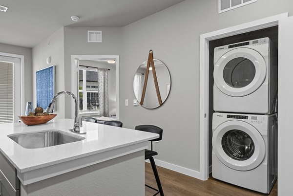 laundry facility at Peak at 1385 Apartments