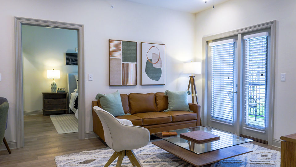 living room at The Waters at West Village Apartments 