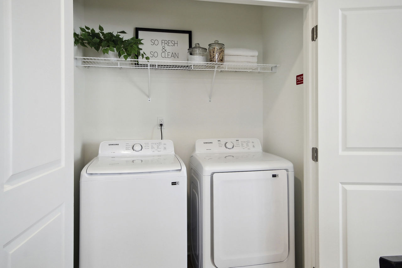 Laundry room at Norwood Steele Creek Apartments