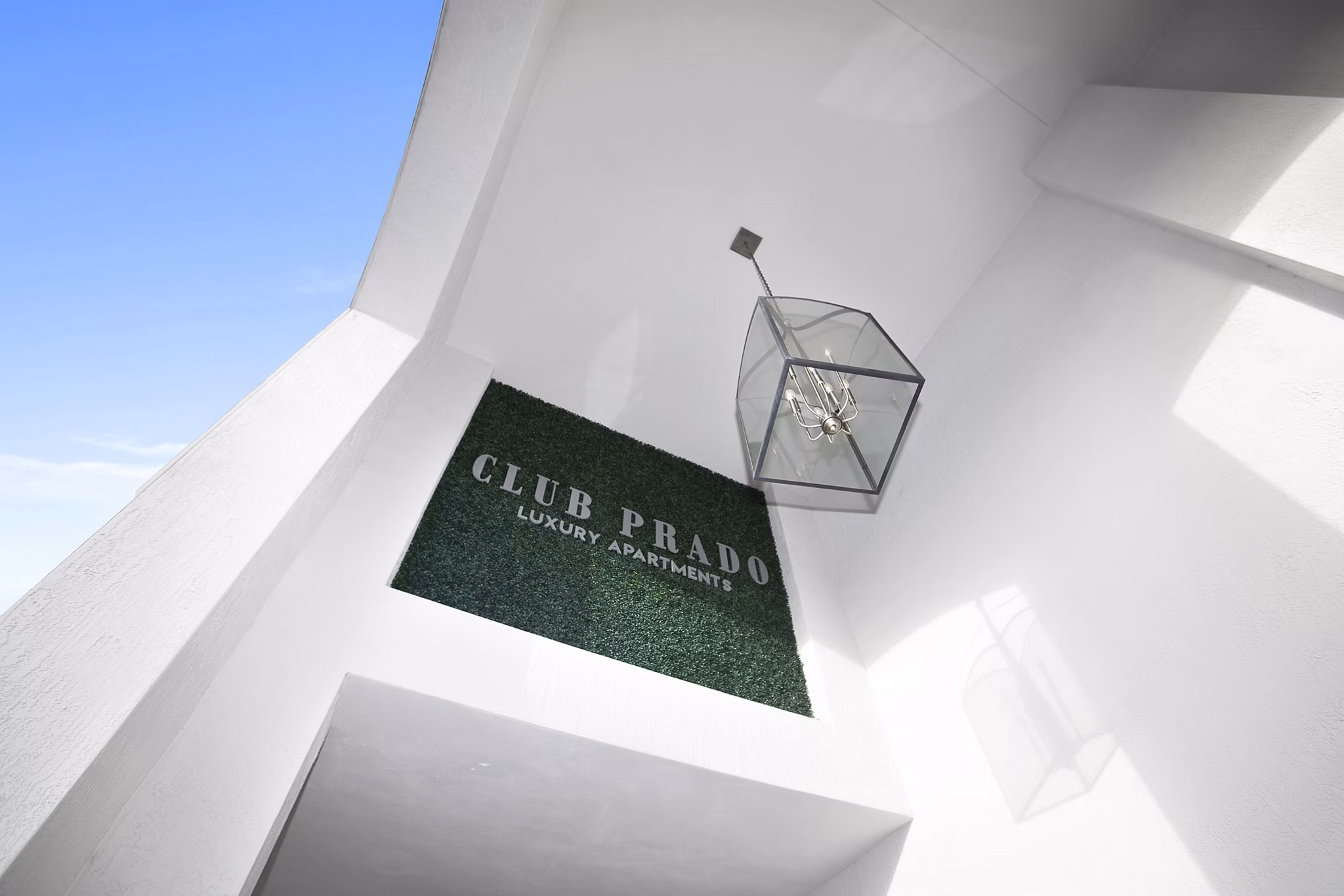 signage at Club Prado Apartments
