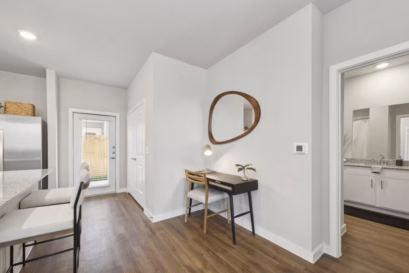 home office/living room at Cottages at Lindsey Place Apartment Homes