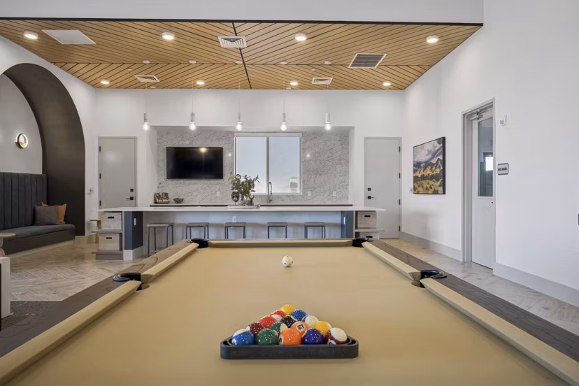 clubhouse game room area at Ascend at Longbow Highpoint Apartments