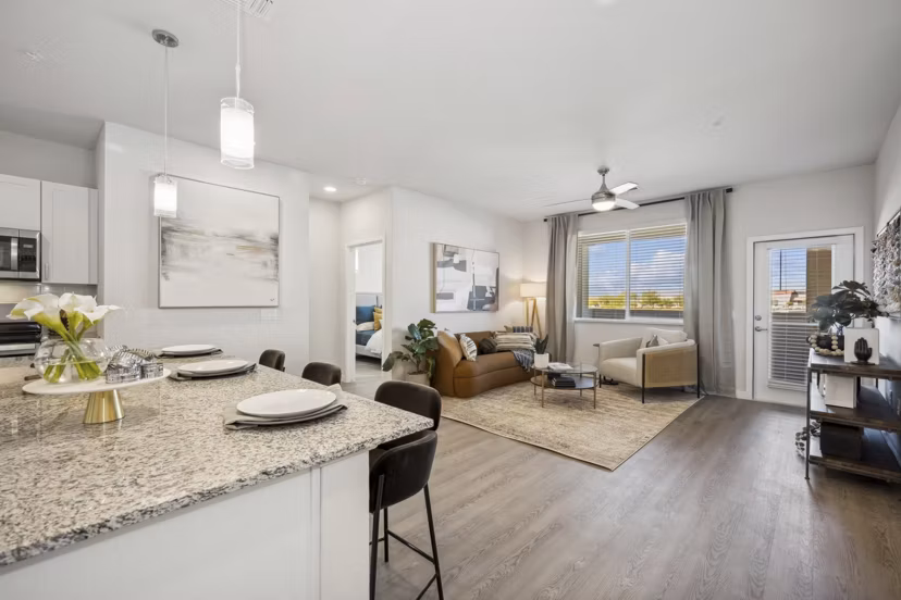 kitchen and living room at Ascend at Longbow Highpoint Apartments