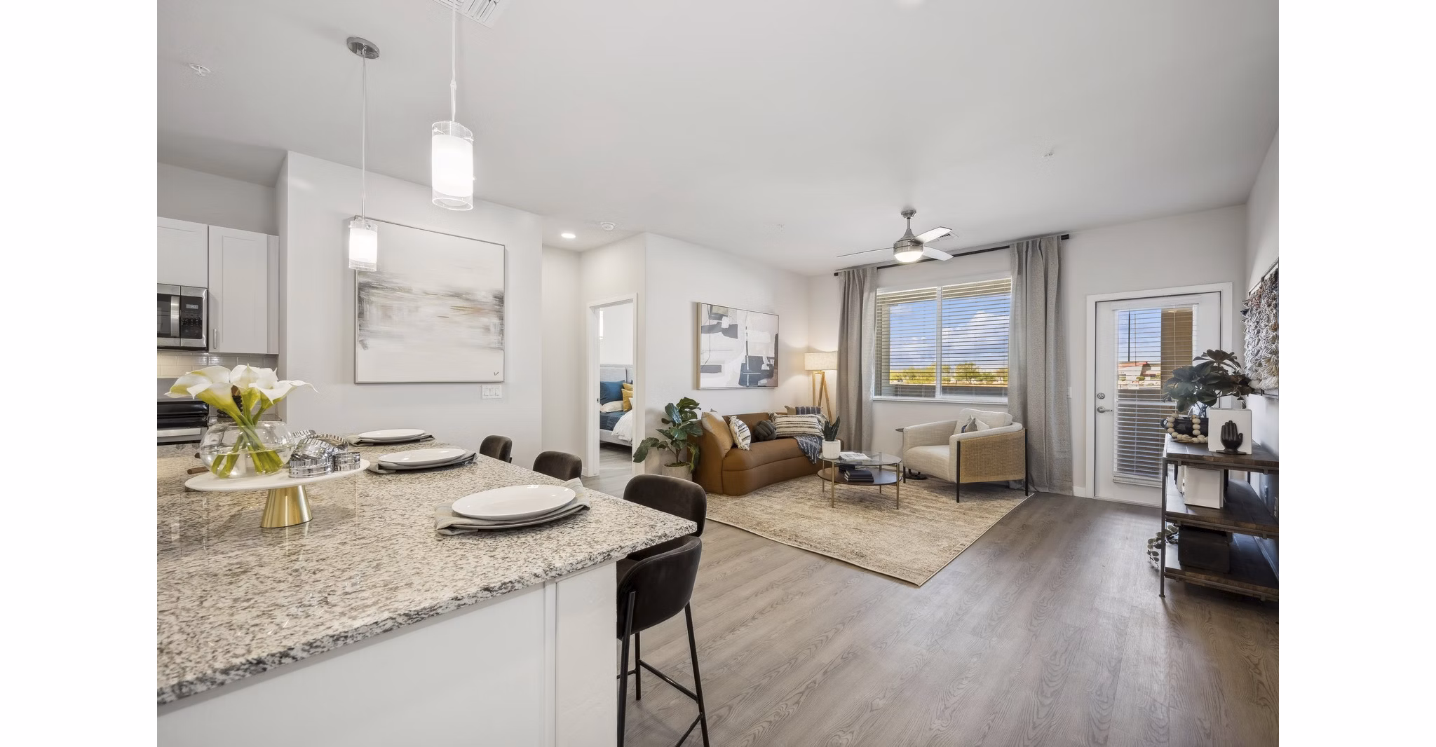 kitchen and living room at Ascend at Longbow Highpoint Apartments
