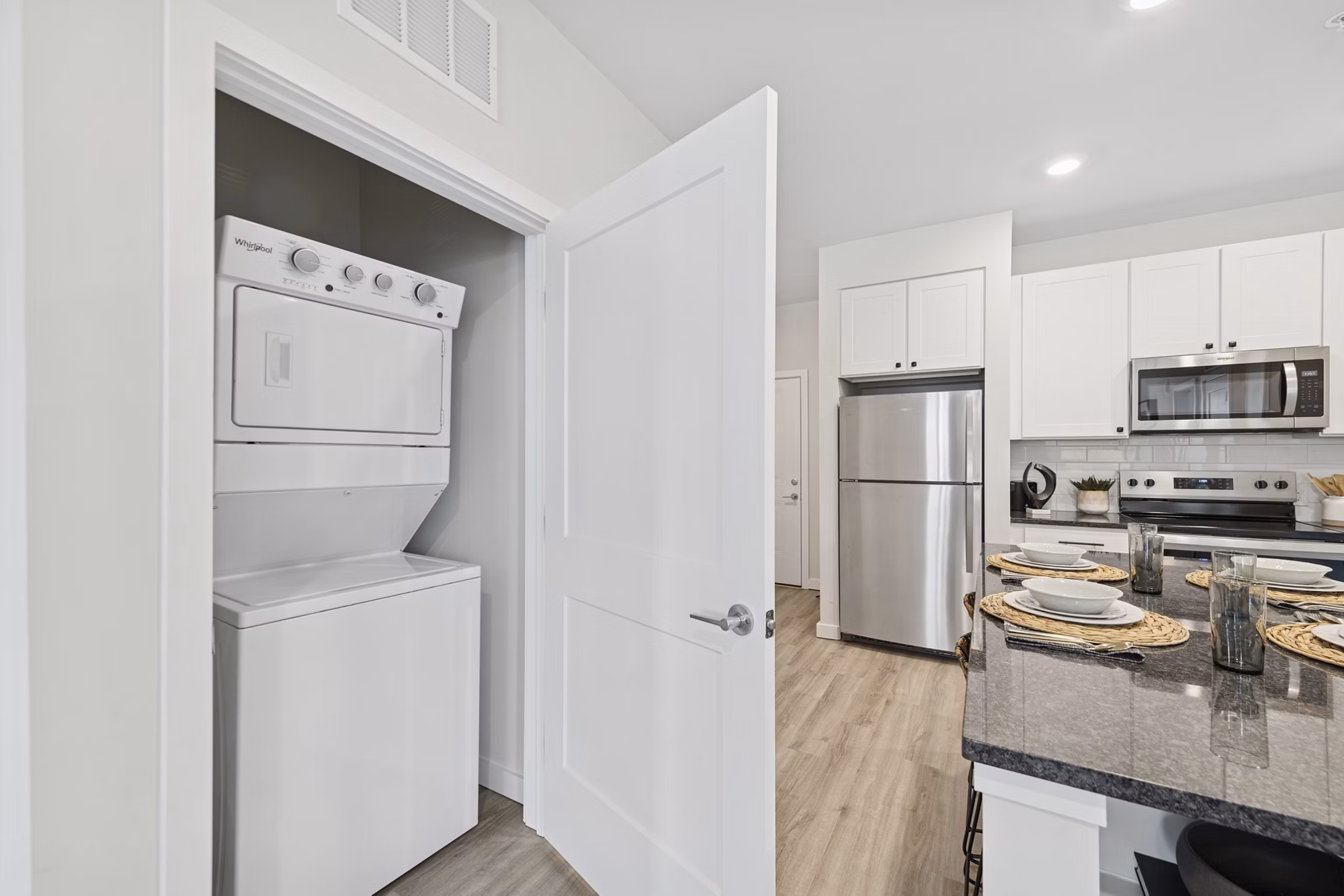 laundry room and kitchen at Ascend Brightleaf Apartments