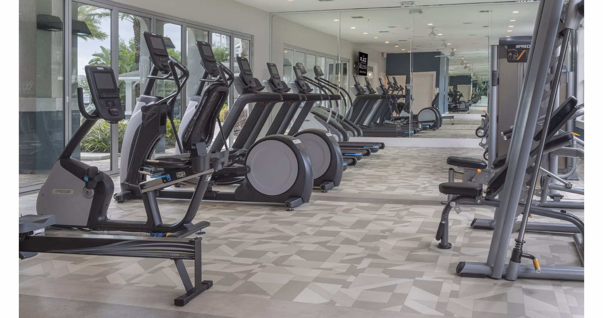fitness center at The Place on Millenia Apartments