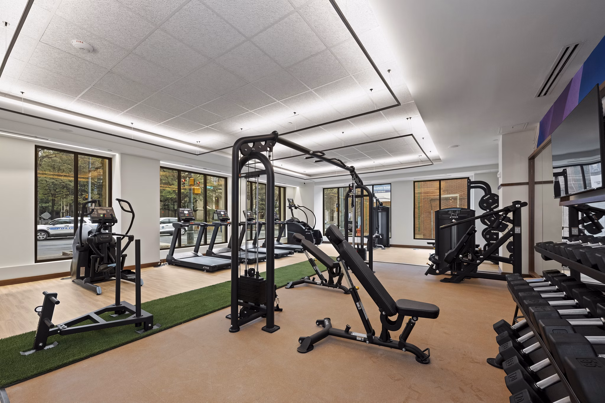 fitness center at Trella Uptown Apartments