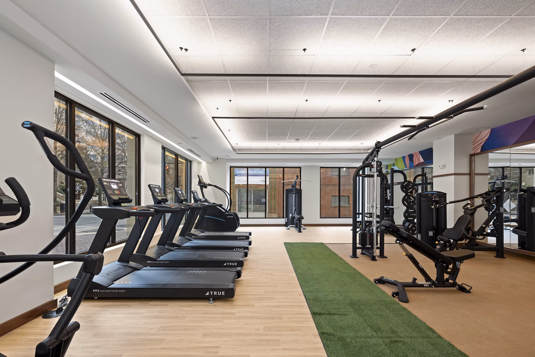 fitness center at Trella Uptown Apartments