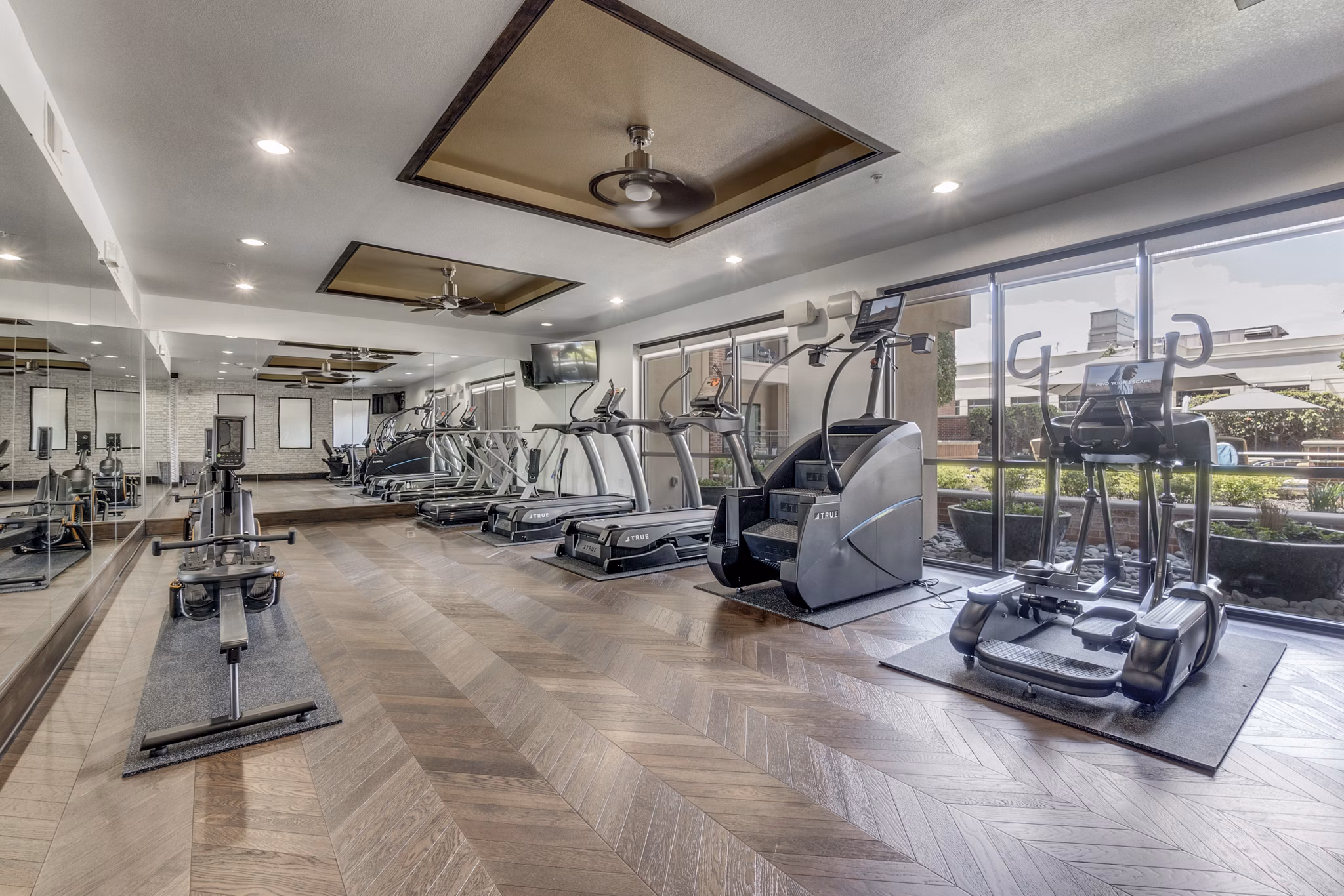fitness center at The Armstrong at Knox Apartments