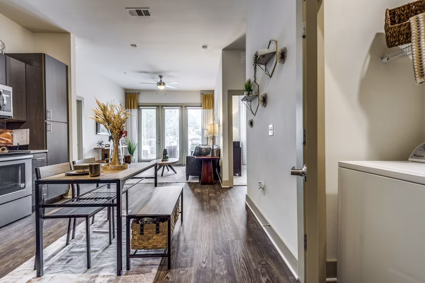 kitchen, dining area and laundry area at The Pierpont Apartments