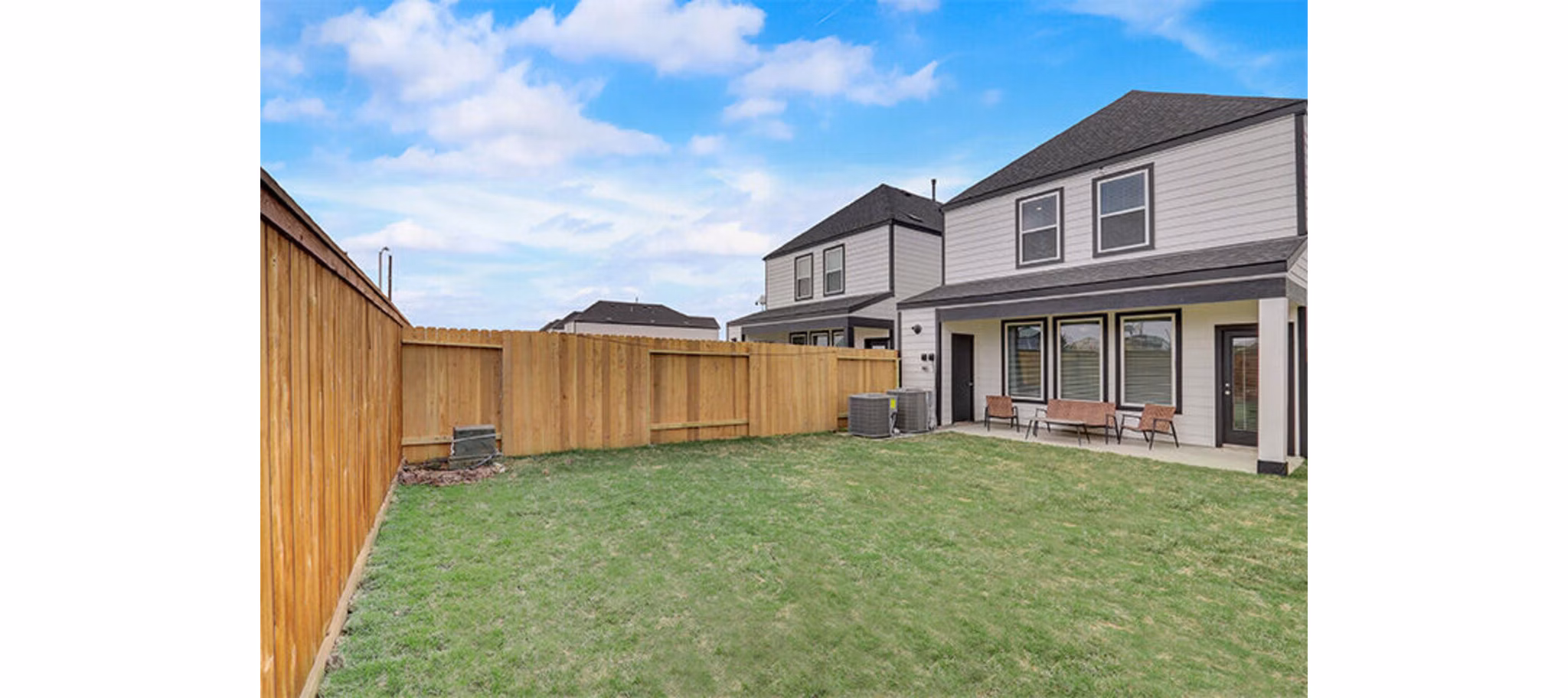 backyard/patio at The Oaks at Grand West Apartment Homes