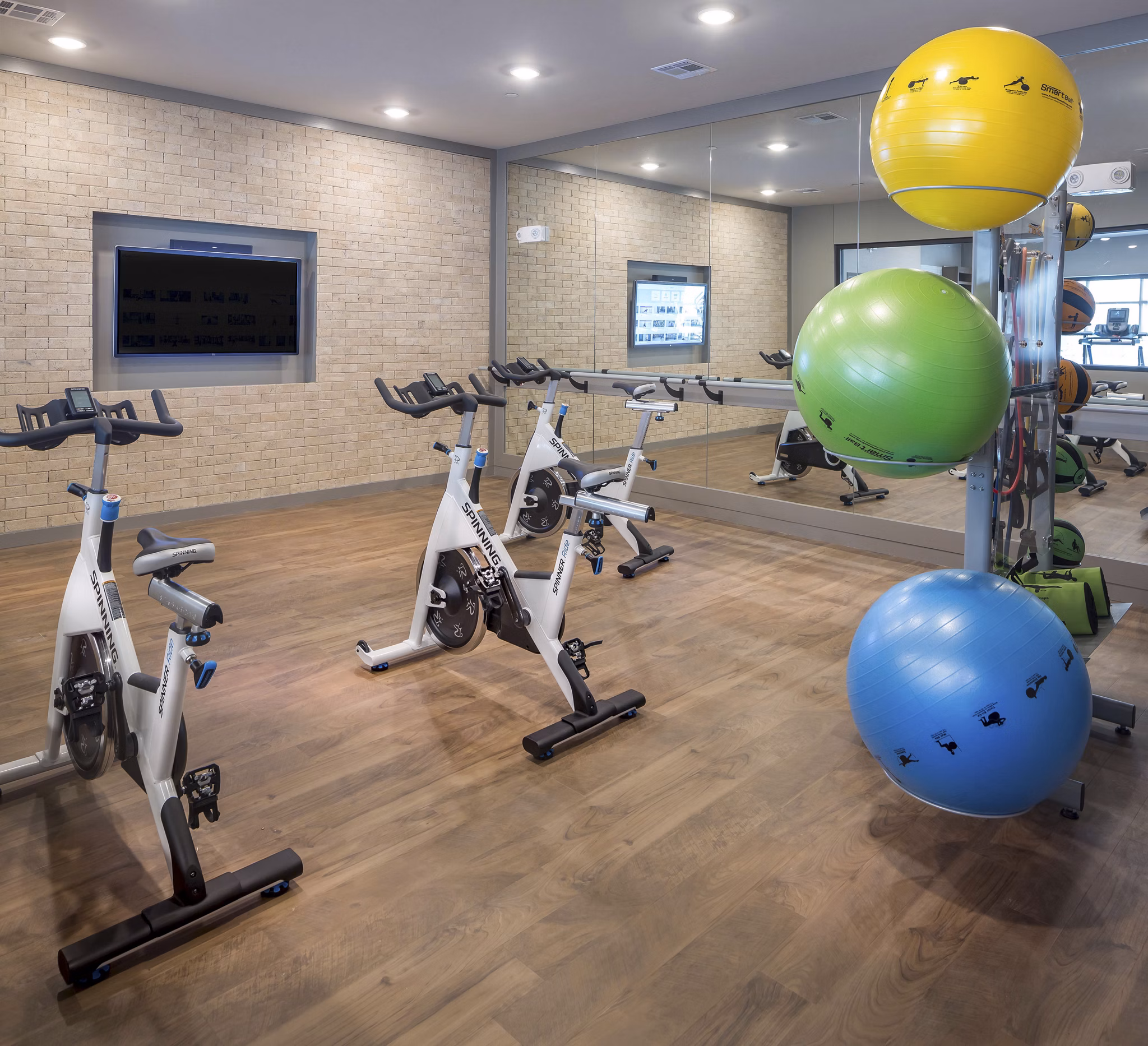 fitness center at Amelia at Farmers Market Apartments