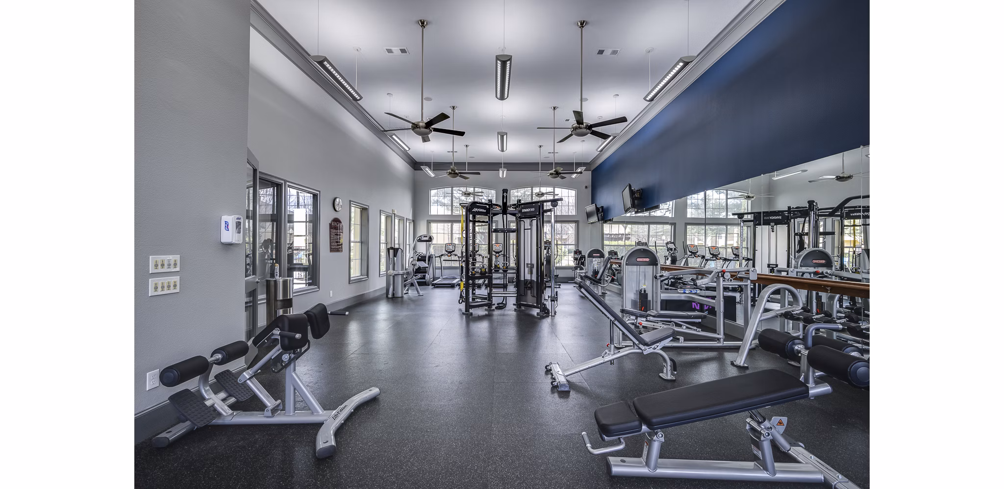 fitness center at Riachi at One21 Apartments