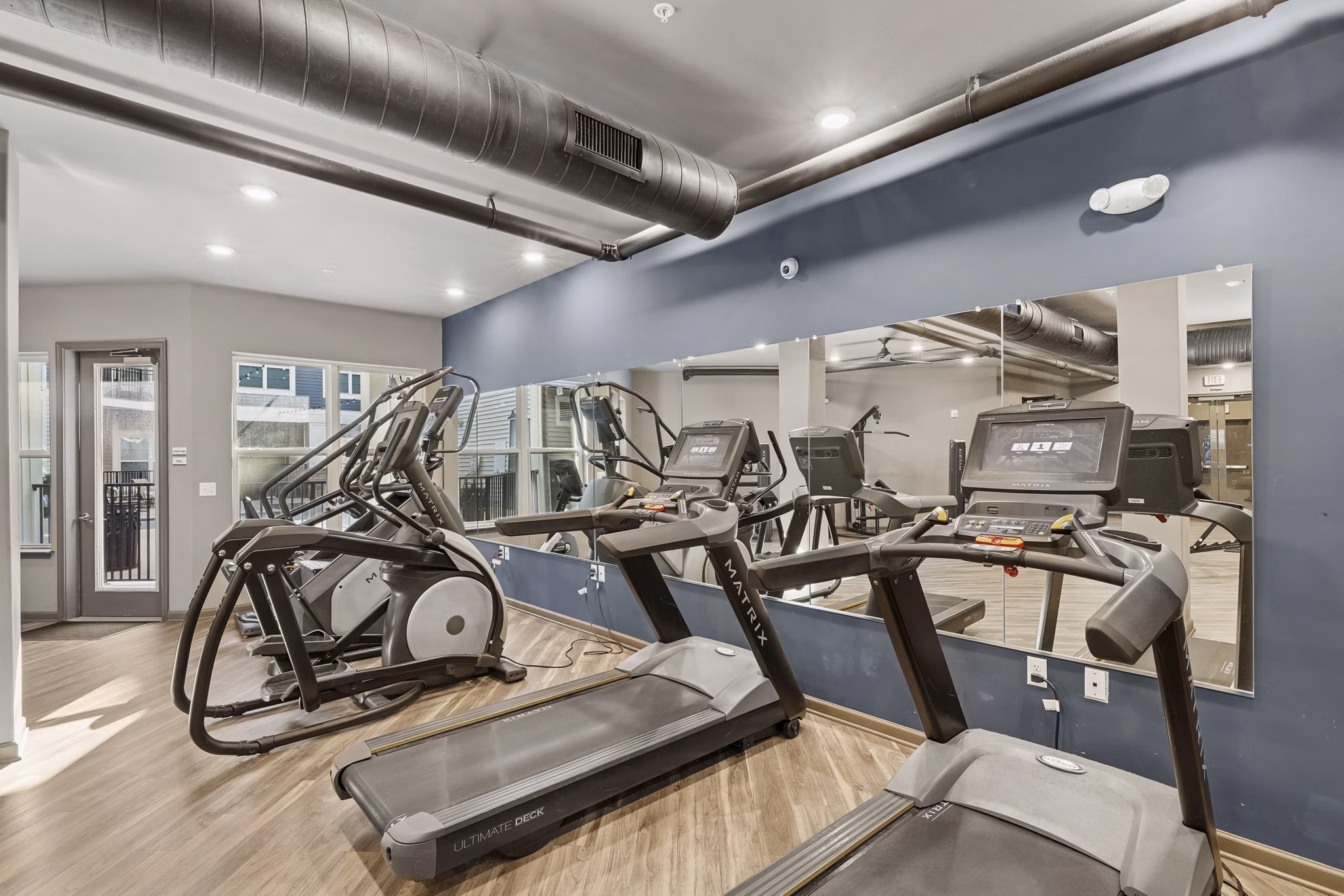 fitness center at Nexus Apartments