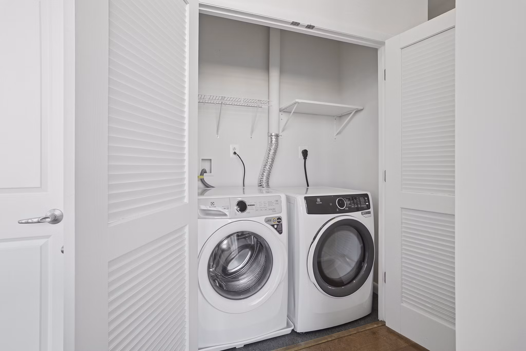 laundry room at Millennium at National Landing Apartments
