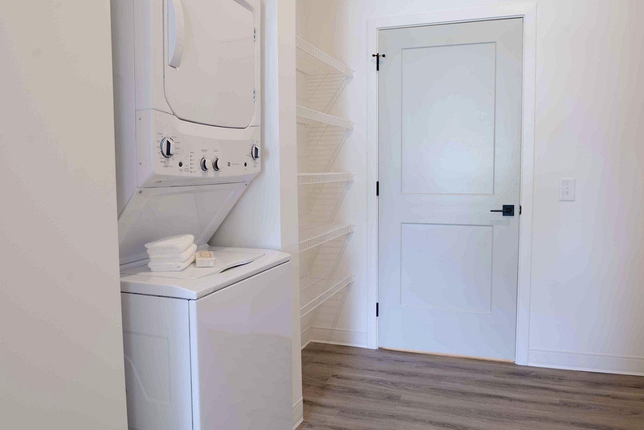Laundry room at Irvington Place Apartments St Louis