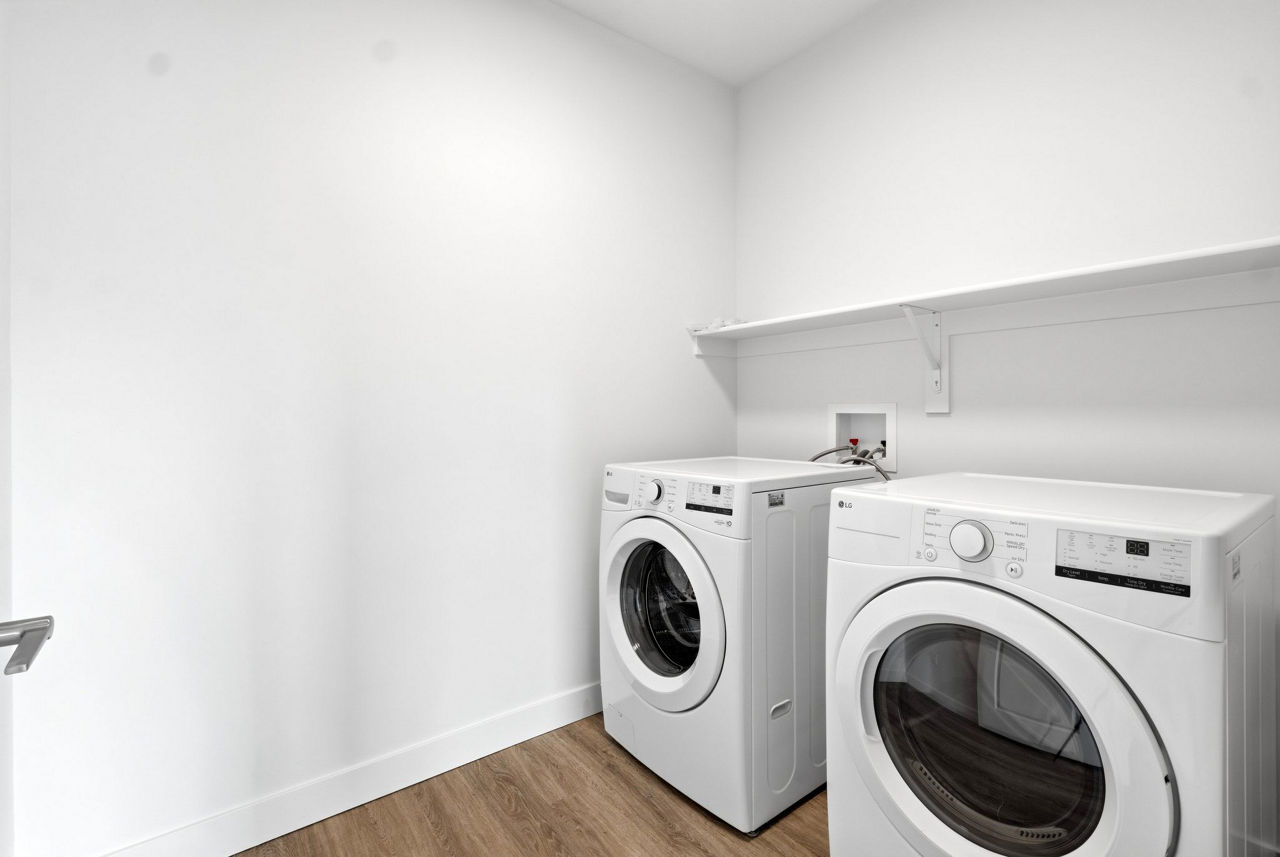 Laundry room at The Henley Apartments