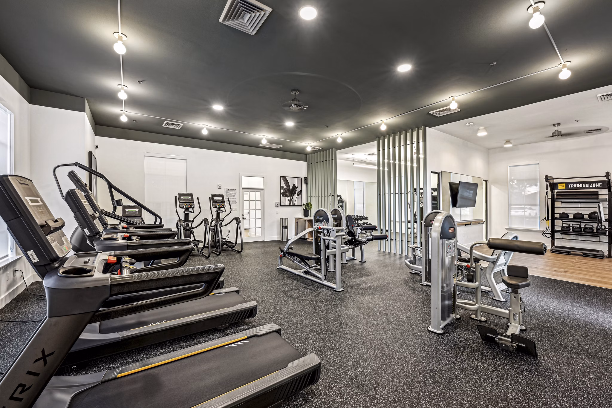 fitness center at Tortuga Bay at Waterford Lakes Apartments