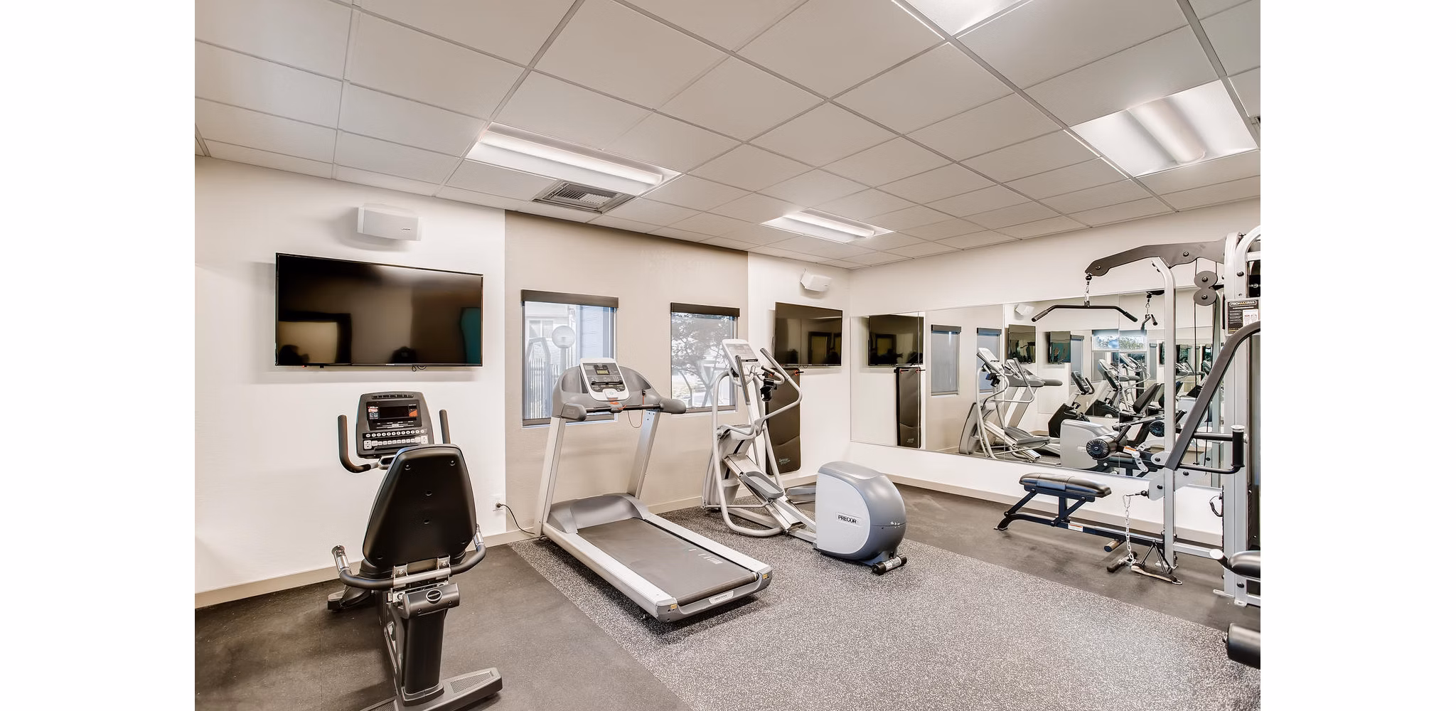 fitness center at The Harlow Apartments