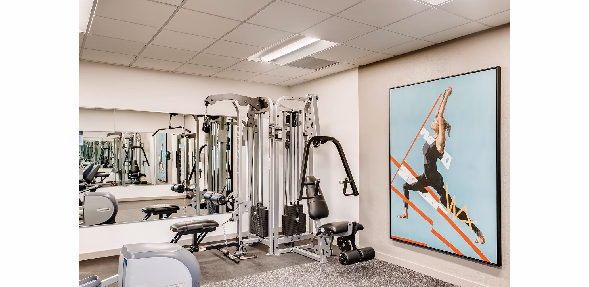 fitness center at The Harlow Apartments