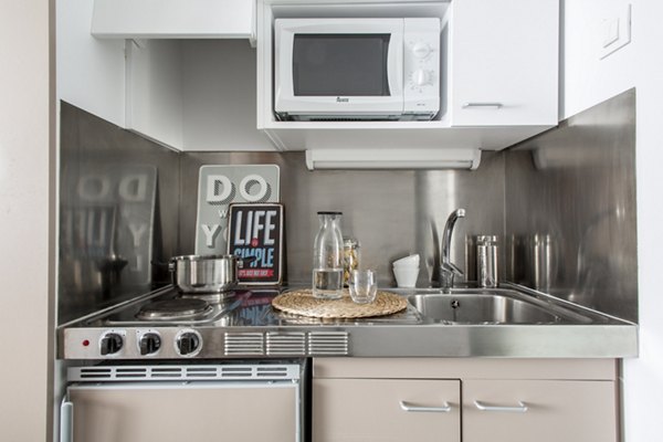 Kitchens with modern appliances in Roberto de Nobili Residence Hall