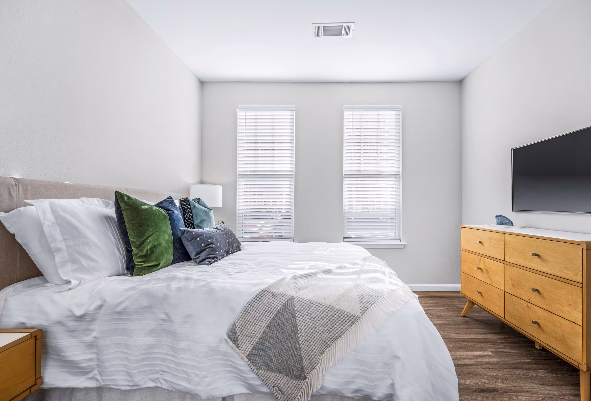 Cozy bedroom with modern decor at Jefferson at Dedham Station Apartments