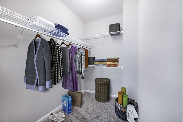 Spacious bedroom closet with custom shelving at Jefferson at Dedham Station Apartments, offering ample storage solutions for organized living