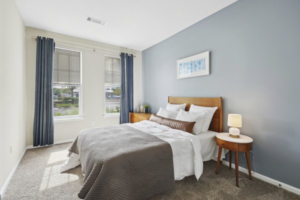 Modern bedroom with stylish decor at Jefferson at Dedham Station Apartments