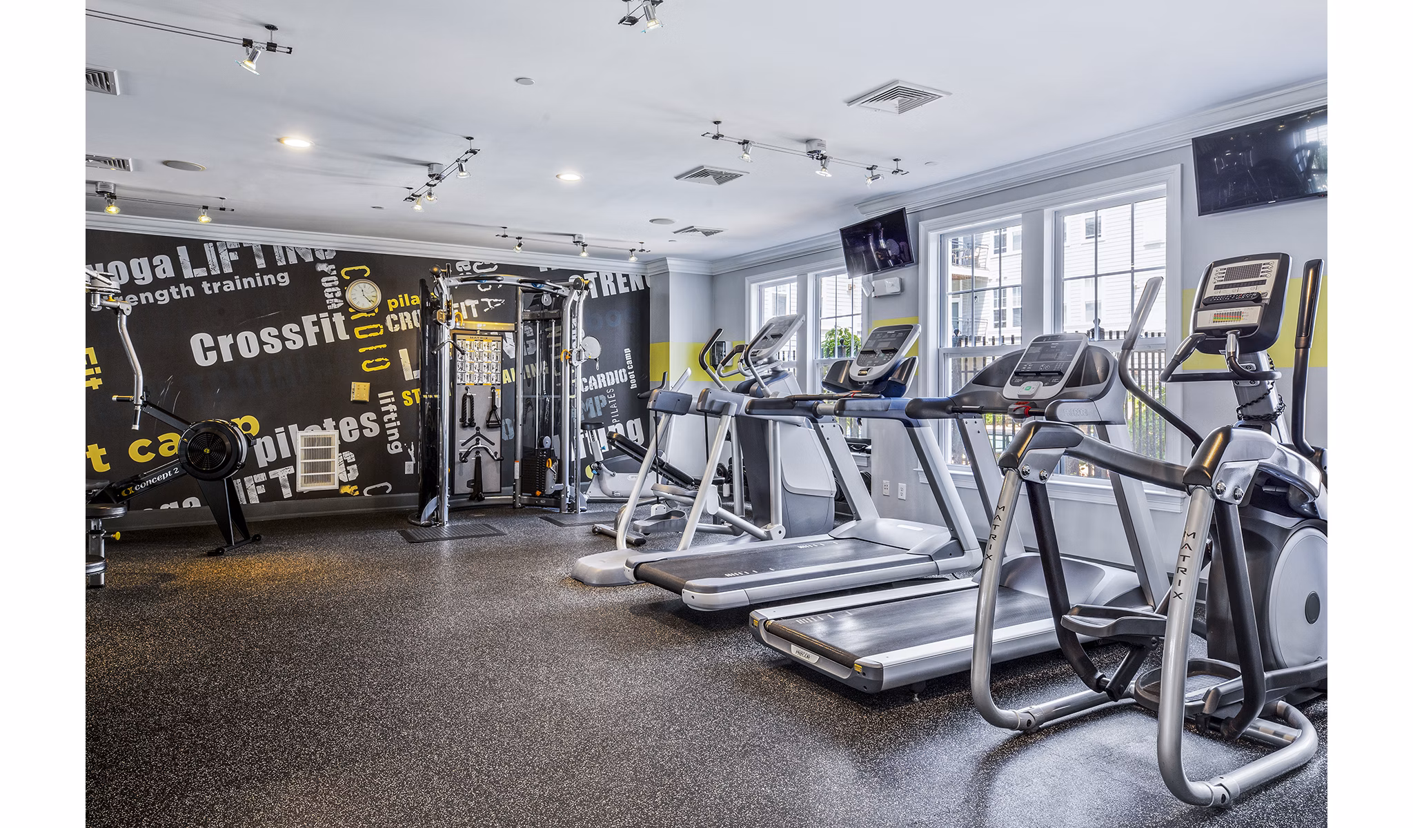 State-of-the-art fitness center at Jefferson at Dedham Station Apartments, featuring modern equipment and spacious workout areas