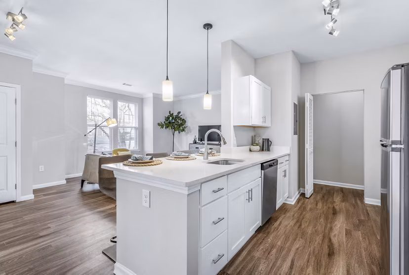 Modern kitchen with stainless steel appliances at Jefferson at Dedham Station Apartments