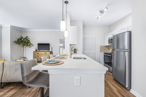 Modern kitchen with stainless steel appliances at Jefferson at Dedham Station Apartments